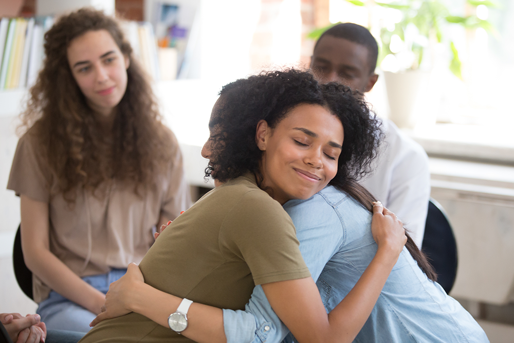 two-women-hugging