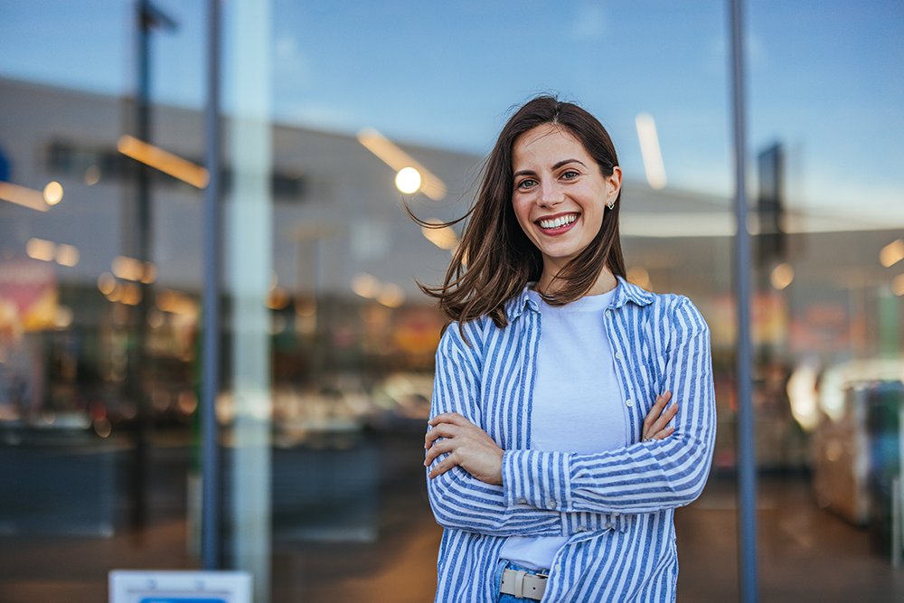 woman-smiling-with-her-arms-crossed